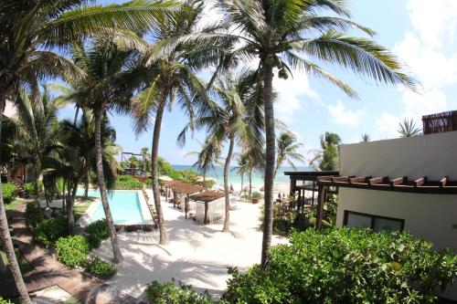 a view of the beach from the balcony of a resort at Maria Del Mar Tulum - Adults Only in Tulum