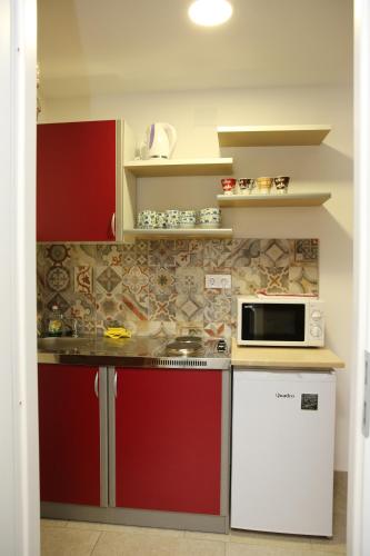 Η κουζίνα ή μικρή κουζίνα στο Apartman Kupa