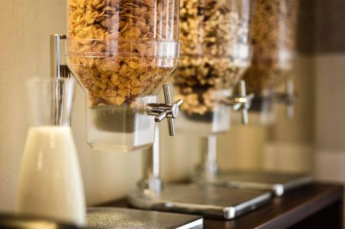 a food processor filled with food on top of a counter at Martins Klause Airport Messe Hotel - self-check-in available in Leinfelden-Echterdingen