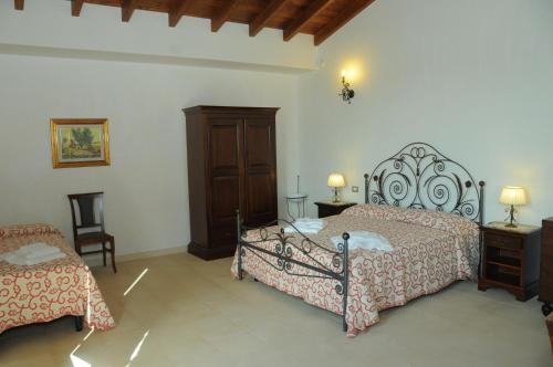 מיטה או מיטות בחדר ב-Agriturismo Masseria Quaremme