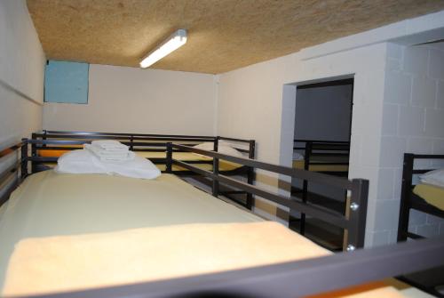 a room with two bunk beds in a room at Hotel Des Alpes in Kandersteg