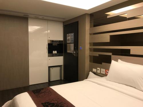 En eller flere senger på et rom på Open Room Hotel