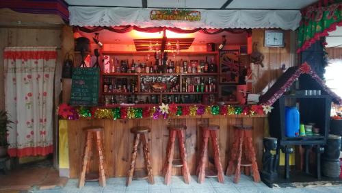 a bar with stools in front of it at Las vegas lodge and restaurant in Banaue