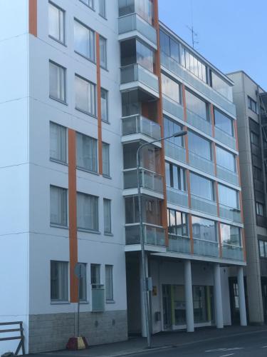 an apartment building on a street with a street light at Antintorni Apartment 14 in Pori