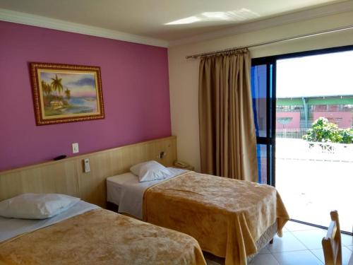 Ένα ή περισσότερα κρεβάτια σε δωμάτιο στο Sokulski Park Hotel