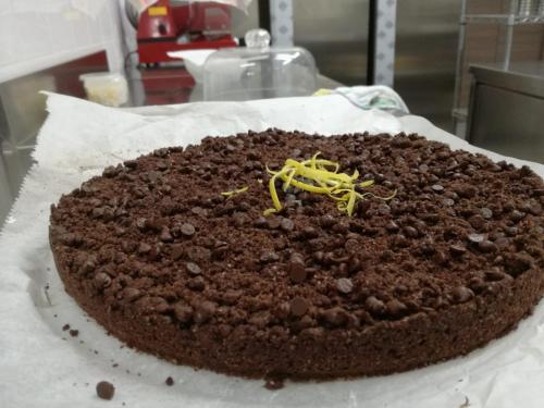 a chocolate cake sitting on top of a table at Mama Lina in Patti