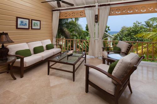 a living room with a couch and a table at Little Good Harbour in Saint Peter