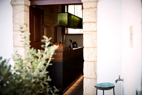 a kitchen with a counter and a sink in a room at Aquamarea in Polignano a Mare
