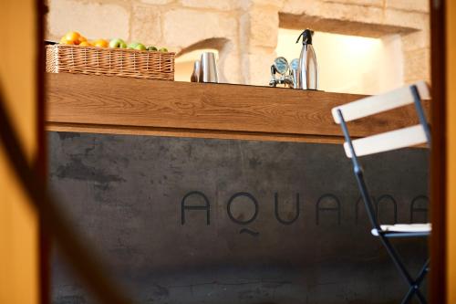 a counter top with a bowl of fruit on it at Aquamarea in Polignano a Mare