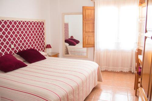 Postel nebo postele na pokoji v ubytování Hostal El Pozo
