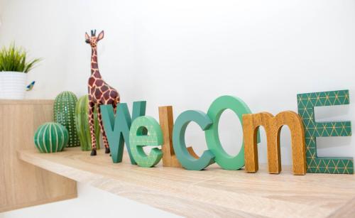 a sign with a giraffe on a shelf at El Mirador De Villamartin - La Zenia & Golf in Playas de Orihuela