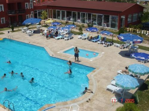a group of people in a swimming pool at Samdan Hotel in Pamukkale