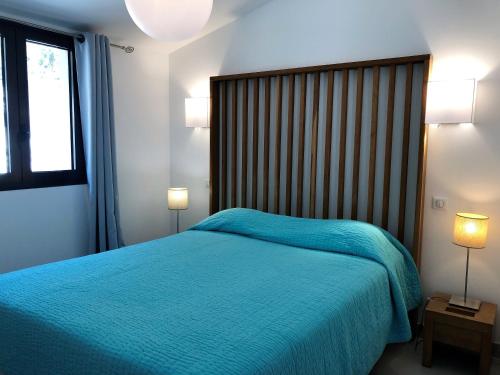 Ένα ή περισσότερα κρεβάτια σε δωμάτιο στο Les Appartements du Port