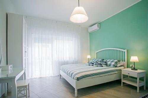 מיטה או מיטות בחדר ב-B&B Sapore di Mare al Corso