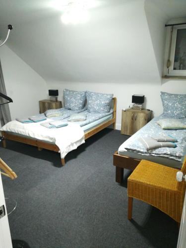 a room with two beds and a couch in it at Royal Guest House II in Viersen