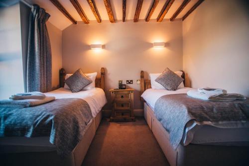 Postel nebo postele na pokoji v ubytování Tynycornel Hotel