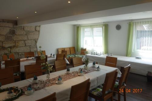 a large room with tables and chairs in it at Gasthof Postkutsche in Motten