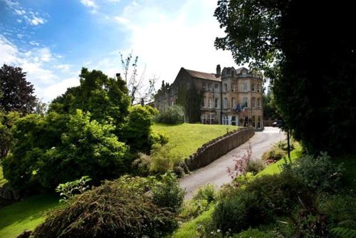 a large house on a hill with a road at Best Western Limpley Stoke Hotel in Bath
