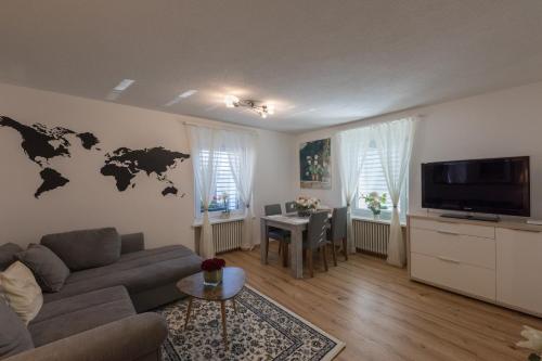 TV a/nebo společenská místnost v ubytování Muhusin Apartments