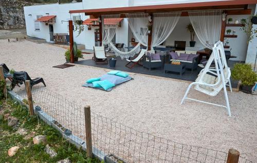 a yard with a hammock and a house at Quinta da Villa in Cascais