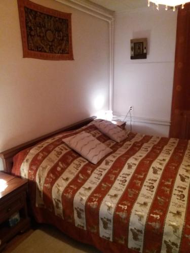 
Ein Bett oder Betten in einem Zimmer der Unterkunft Chambres d'hôtes chez Pierrot et Flo
