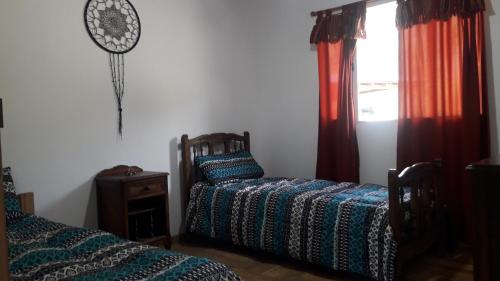 Posteľ alebo postele v izbe v ubytovaní El Jarillal Chalet de Montaña a pasos del lago