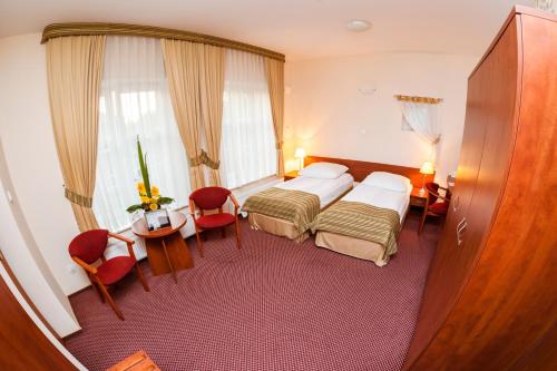 Posteľ alebo postele v izbe v ubytovaní Hotel Logos