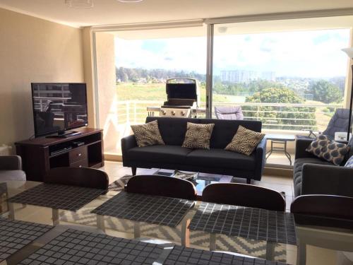 Et opholdsområde på Laguna Bahía Algarrobo edificio Océano 406