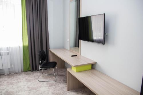 TV a/nebo společenská místnost v ubytování Aсe Hotel