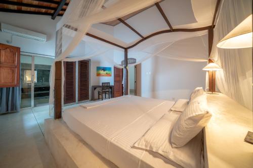 Ένα ή περισσότερα κρεβάτια σε δωμάτιο στο Greenparrot-Villa