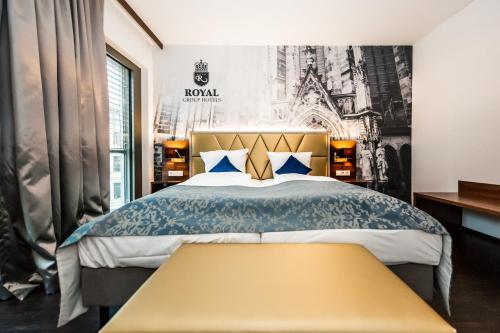 En eller flere senge i et værelse på Best Western Plus Royal Suites