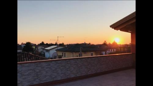 a view of the sunset from a balcony of a house at Via Venezia Accomodating Solutions in Lonigo