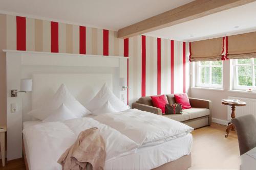 Ein Bett oder Betten in einem Zimmer der Unterkunft Tiemann's Hotel