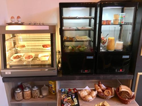 an open refrigerator with food inside of it at Koetshuis Bosdam in Beveren
