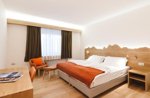 Postel nebo postele na pokoji v ubytování Residence Langes