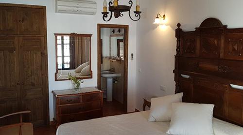 Ένα ή περισσότερα κρεβάτια σε δωμάτιο στο Hotel Rural La Casa de los Tres Cielos