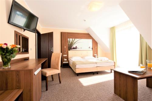 Uma cama ou camas num quarto em Puchacz - Spa