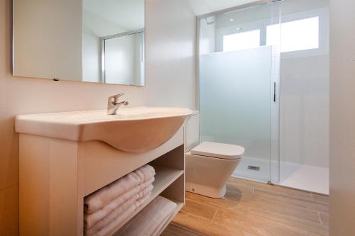 a bathroom with a sink and a toilet at Apartamentos Sol y Vera in Magaluf