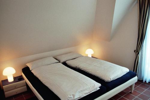 Postel nebo postele na pokoji v ubytování Appartement Kayser Sylt