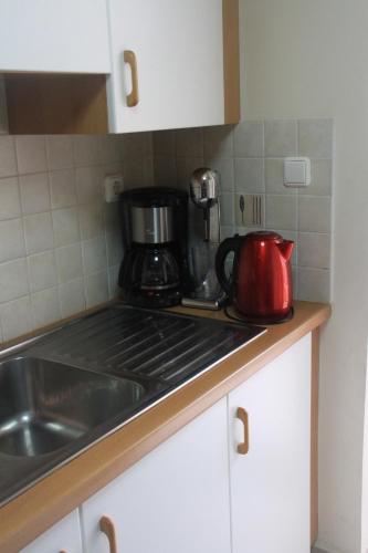 a kitchen counter with a coffee pot on the stove at Quiet spacious apartment in Nafplio in Nafplio
