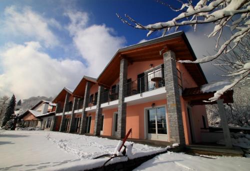 a building with snow in front of it at Garni Viggiona in Trarego