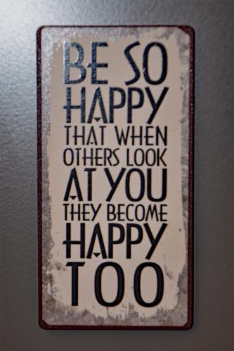 a sign that says be so happy that when others look at you they become happy at Antwerp old town appartment in Antwerp