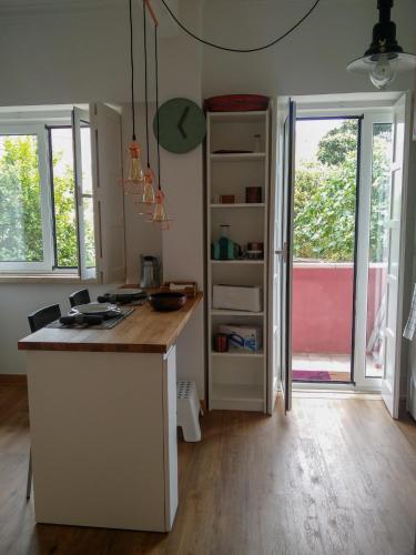 a kitchen with a island with a counter top at Casa da Tia Adozinda in Lisbon