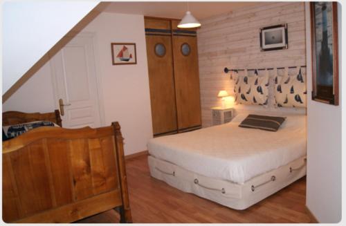Cama ou camas em um quarto em Maison d'Hôtes de Kerzine