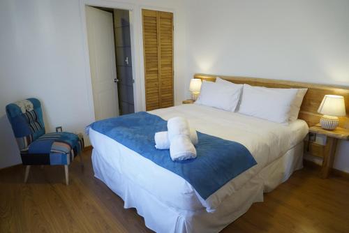 Postel nebo postele na pokoji v ubytování Hostal Doble E Patagonia