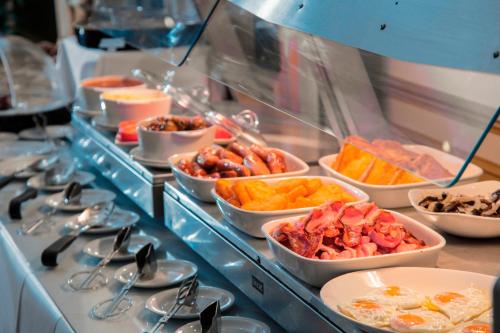 a buffet line with many different types of food at Best Western Homestead Court Hotel in Welwyn Garden City