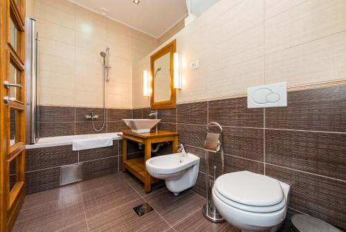 a bathroom with a toilet and a sink at Apartment Anna in Dubrovnik