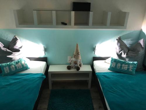 En eller flere senge i et værelse på Hahnenklee Ferienpark 136