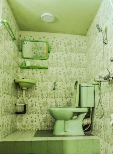 a bathroom with a toilet and a sink at Top View in Hatton