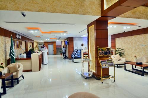 a lobby of a store with a hair salon at Your Home Apartment Hotel in Dammam